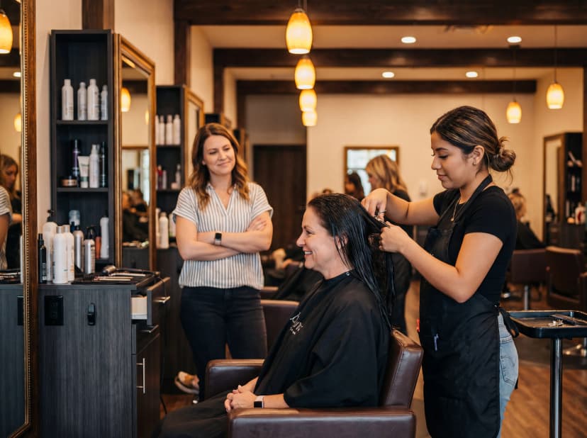 ICBAS Hairstyling students practicing cutting and styling